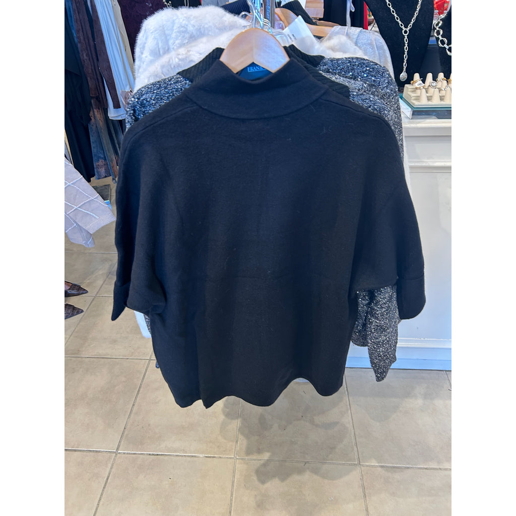 Original front and back photographs of the black Metric Knits style 12579- cardigan with a mock neck, zip front and turn-back cuffs.